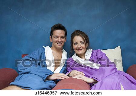 Stock Photo - couple relaxing at spa in bath robes. Fotosearch