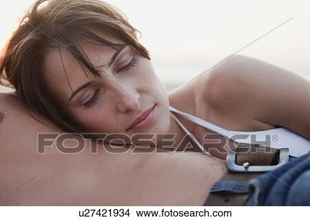 couple relaxing on the beach View Large Photo Image Picture - couple relaxing on the beach. Fotosearch