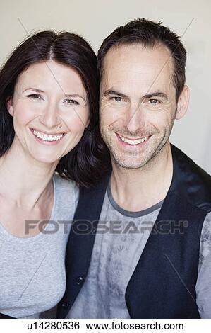 Stock Photograph - couple smiling at viewer. Fotosearch