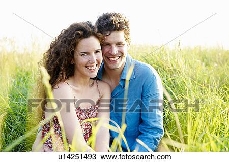 Couple smiling in a wheat field View Large Photo Image Stock Image - Couple smiling in a wheat field. Fotosearch