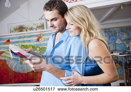 couple studying catalogue View Large Photo Image Stock Photo - couple studying catalogue. Fotosearch