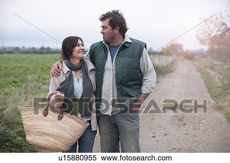 couple walking in country lane View Large Photo Image Stock Photography - couple walking in country lane. Fotosearch