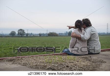couple watching sunrise over fields View Large Photo Image Stock Image - couple watching sunrise over fields. Fotosearch