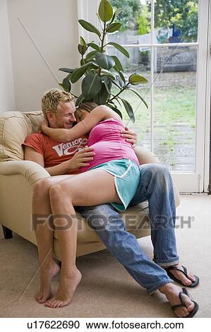 Couple with pregnant woman hugging View Large Photo Image Stock Image - Couple with pregnant woman hugging. Fotosearch