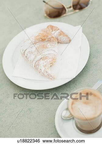 croissant and coffee and sunglasses View Large Photo Image Stock Photograph - croissant and coffee and sunglasses. Fotosearch