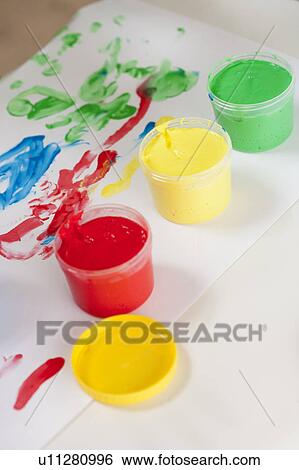 Stock Photograph - cups with different colours of paint. Fotosearch