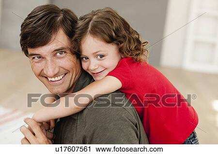daughter riding on father's back View Large Photo Image Stock Image - daughter riding on father's back. Fotosearch