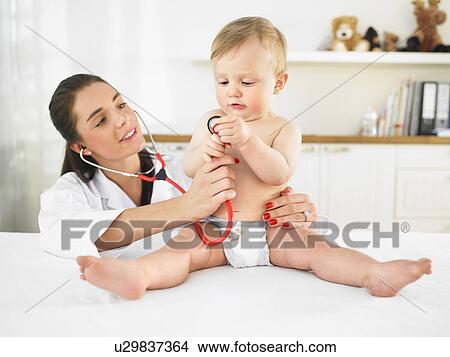 Picture - Doctor and baby. Fotosearch