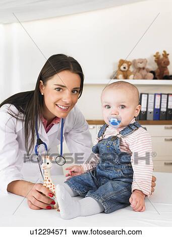 Stock Image - Doctor and baby. Fotosearch