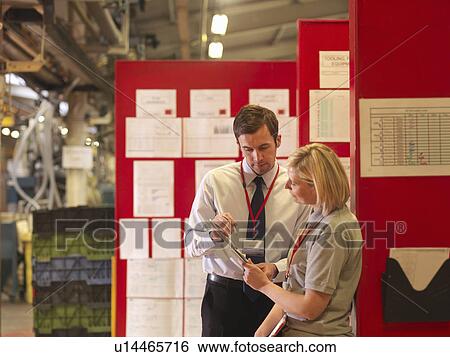 Factory Supervisor Talking To Worker View Large Photo Image Stock Photograph - Factory Supervisor Talking To Worker. Fotosearch