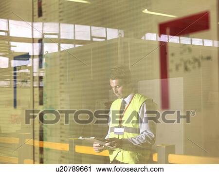 Factory Supervisor With Clipboard View Large Photo Image Stock Image - Factory Supervisor With Clipboard. Fotosearch