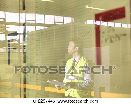 Stock Photography - Factory Supervisor With Clipboard. Fotosearch