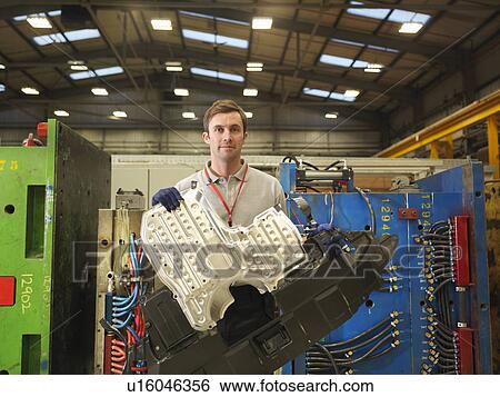 Factory Worker Holding Machine Part View Large Photo Image Stock Photograph - Factory Worker Holding Machine Part. Fotosearch