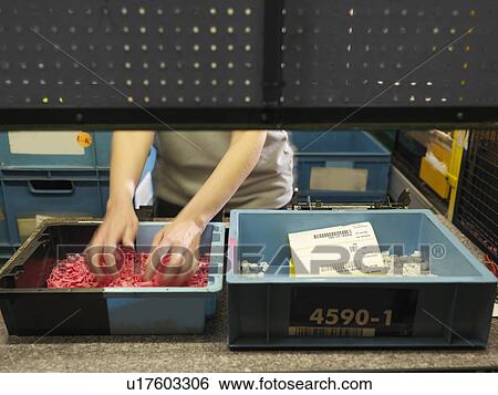 Factory Worker Sorting Plastic Parts View Large Photo Image Stock Photograph - Factory Worker Sorting Plastic Parts. Fotosearch