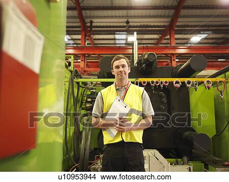Picture - Factory Worker With Clipboard. Fotosearch