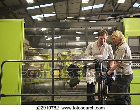 Factory Workers Inspecting Parts View Large Photo Image Stock Image - Factory Workers Inspecting Parts. Fotosearch