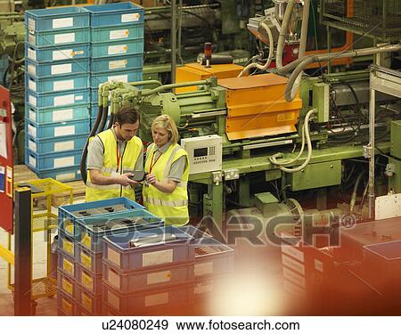 Stock Photo - Factory Workers On Factory Floor. Fotosearch