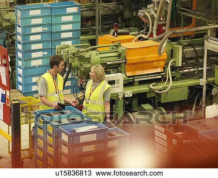 Factory Workers Talking On Factory Floor View Large Photo Image Stock Image - Factory Workers Talking On Factory Floor. Fotosearch