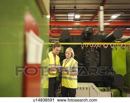 Stock Image - Factory Workers With Clipboard. Fotosearch