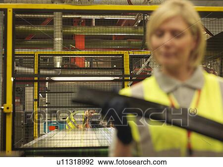Factory Workers Working With Metal View Large Photo Image Stock Image - Factory Workers Working With Metal. Fotosearch
