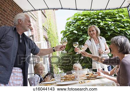 family having a barbecue View Large Photo Image Stock Image - family having a barbecue. Fotosearch