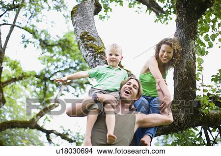 Picture - family in a garden. Fotosearch