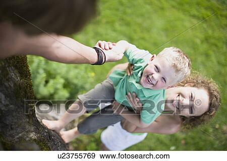 family in a garden View Large Photo Image Stock Photo - family in a garden. Fotosearch