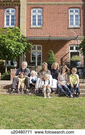 family in front of their home View Large Photo Image Stock Image - family in front of their home. Fotosearch