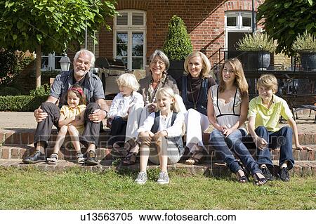family in front of their home View Large Photo Image Stock Photography - family in front of their home. Fotosearch
