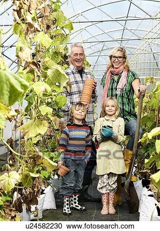 Family in green house View Large Photo Image Stock Image - Family in green house. Fotosearch