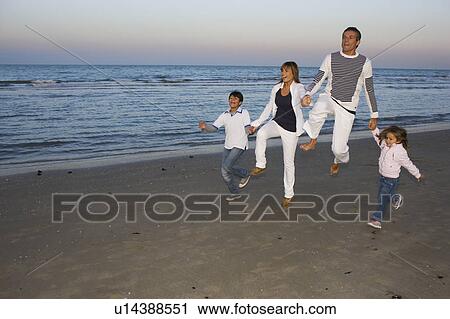 Family on the beach. View Large Photo Image Stock Image - Family on the beach.. Fotosearch