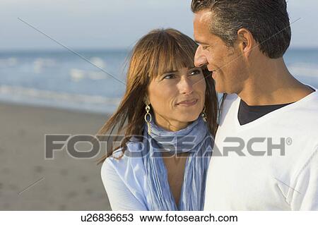 Stock Image - Family on the beach.. Fotosearch