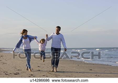 Family on the beach. View Large Photo Image Stock Photograph - Family on the beach.. Fotosearch