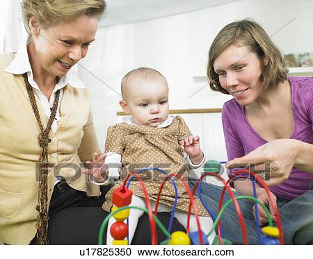 Stock Image - family playing together. Fotosearch