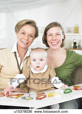 Family reading book View Large Photo Image Stock Photograph - Family reading book. Fotosearch
