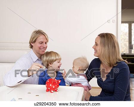 family saving money View Large Photo Image Stock Image - family saving money. Fotosearch
