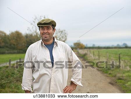 farmer walking in country lane View Large Photo Image Stock Image - farmer walking in country lane. Fotosearch