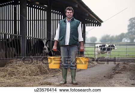farmer with buckets View Large Photo Image Picture - farmer with buckets. Fotosearch