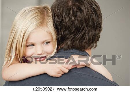 Stock Photo - father and daughter hugging. Fotosearch