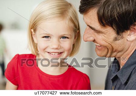 Stock Photo - father and daughter smiling. Fotosearch
