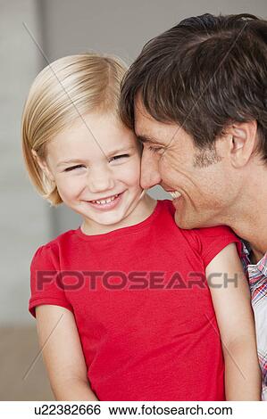 Stock Photograph - father and daughter smiling. Fotosearch