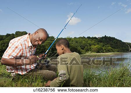 Stock Photograph - father and son fishing. Fotosearch