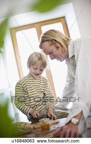 father and son in kitchen View Large Photo Image Stock Image - father and son in kitchen. Fotosearch