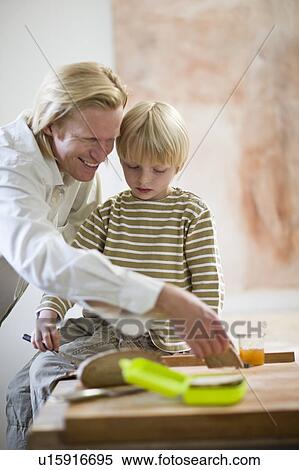 father and son in kitchen View Large Photo Image Stock Photography - father and son in kitchen. Fotosearch
