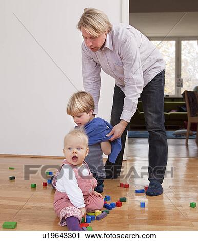 father dressing children View Large Photo Image Stock Image - father dressing children. Fotosearch