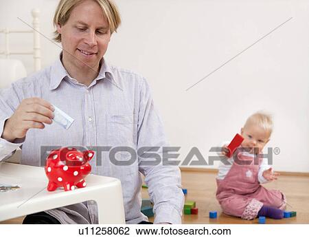 father saving for baby View Large Photo Image Stock Image - father saving for baby. Fotosearch