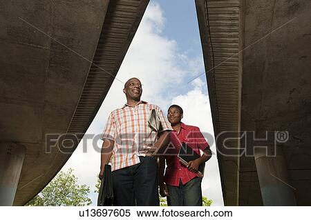 Stock Photography - father & son walking to work. Fotosearch