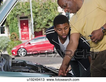 father & son working on car engine View Large Photo Image Stock Image - father & son working on car engine. Fotosearch