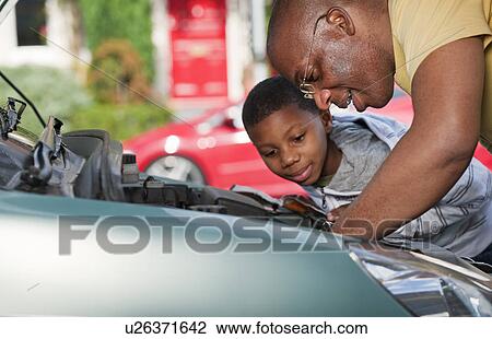 father & son working on car engine View Large Photo Image Stock Image - father & son working on car engine. Fotosearch