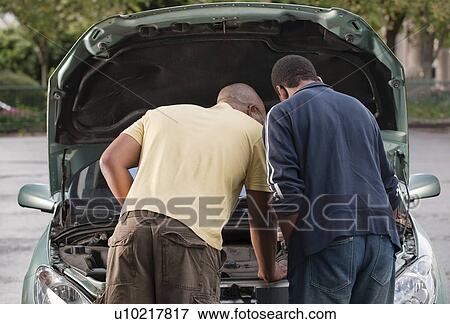 father & son working on car View Large Photo Image Stock Photo - father & son working on car. Fotosearch